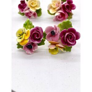 Three sets of vintage porcelain screw back and clip on earrings made in England,